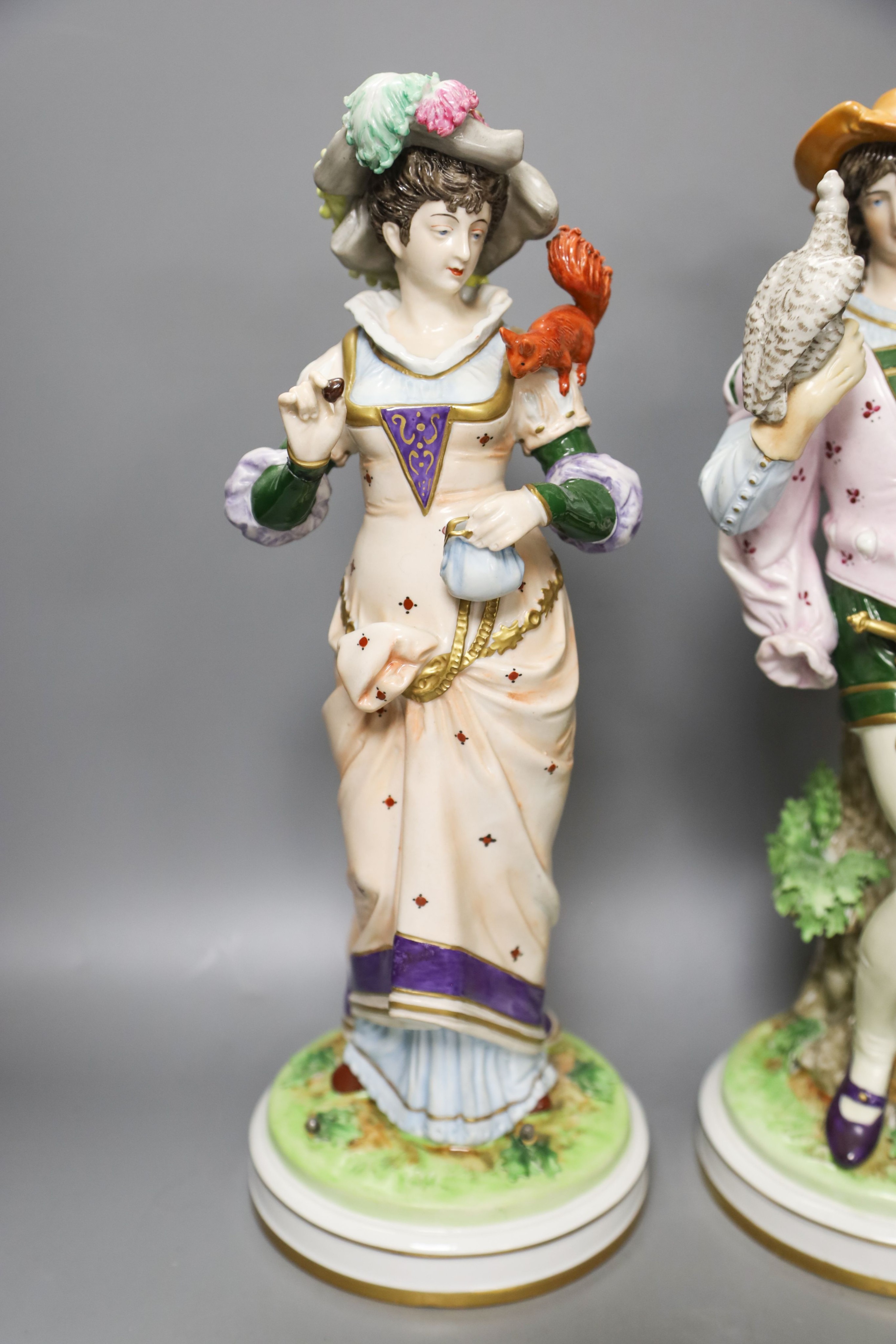 Two pairs of Continental porcelain figures, 35cm